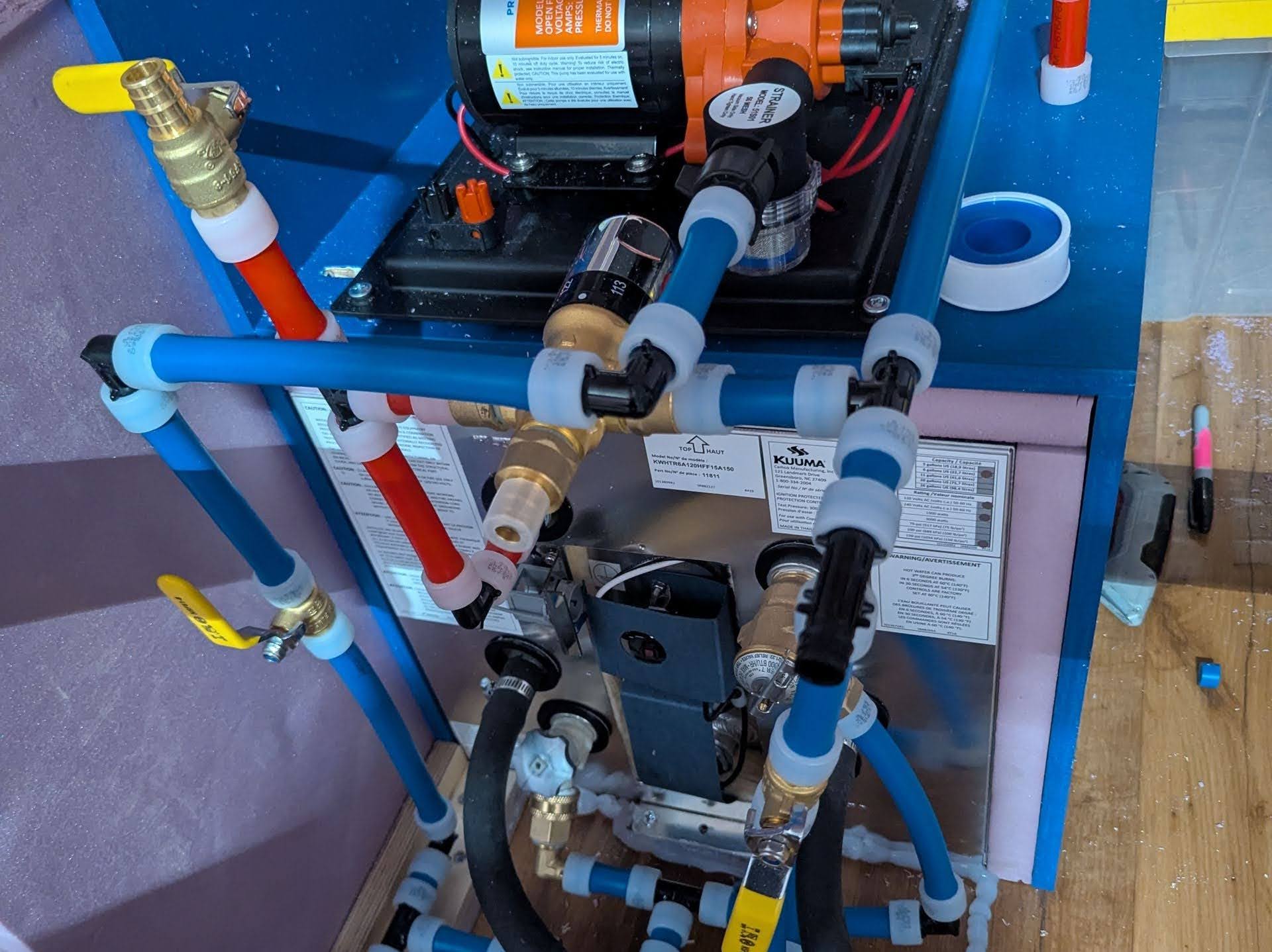 Engine-heated hot water plumbing system